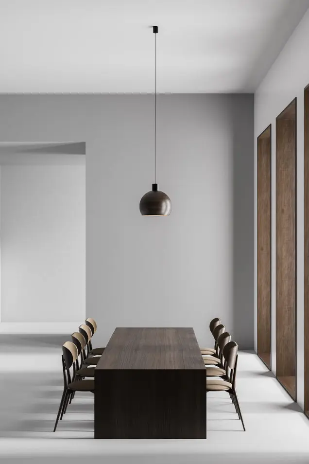Comedor minimalista con paredes y suelo de microcemento