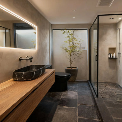 Baño de estilo rústico con paredes de microcemento color Spike, incluida la ducha, y suelo de piedra.