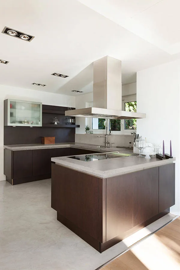 Open kitchen decorated with microcement flooring