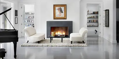 Living room with fireplace and microcement floor